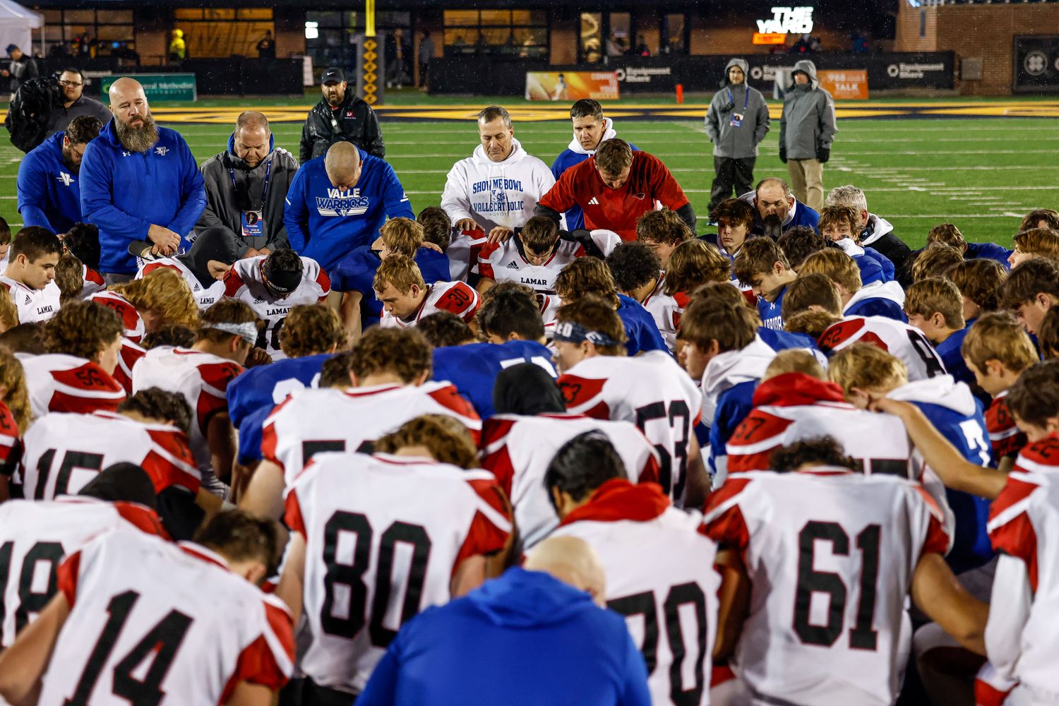 Valle Catholic and Lamar pray together following the 2023 Missouri Class 2 championship game